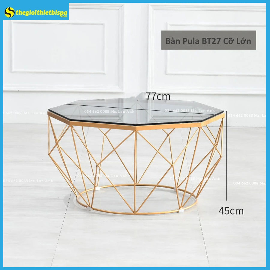 Bàn Trà Sofa Mặt Đá mặt kính cường lực, chân sắt sơn tĩnh điện vàng Mặt bàn : Kính/ Đá Màu sắc mặt bàn: Màu tự nhiên/ Đen/ Trắng Chân kim loại sơn đen từ tính/ sơn vàng Chất liệu sản phẩm: Kim loại/ Kính/ Đá Kích thước tiêu chuẩn : 60*45CM Nhận làm kích thước riêng theo yêu cầu – Chất liệu: Mặt bàn hình bát giác mặt kính, chân thép sơn tĩnh điện đen, trắng, đồng, có thể cảm nhận trực tiếp khi sờ, việc lau chùi các vết thức ăn, bụi bẩn nhanh chóng, không lo ố màu, ẩm mốc xâm nhập, chất liệu hoàn toàn thân thiện với sức khoẻ người dùng. – Mặt bàn: Kính Xanh đen, Trong suốt tròn bo cạnh viền thanh thoát triệt tiêu các cạnh sắc nhọn thông thường phù hợp cho những gia đình có trẻ nhỏ hiếu động và người già tránh sự va chạm gây thương tổn. – Chân bàn: chân thép sơn tĩnh điện đen, trắng, đồng – Màu sắc: Xanh đen, Trong suốt – Xuất xứ: Nhập khẩu. Hãy liên hệ ngay ☎️ Hotline 096 114 3325 Mr. Nhượng để được tư vấn và mua với giá tốt nhất cùng vô vàn ưu đãi hấp dẫn • GIAO HÀNG TOÀN QUỐC Đây là hàng hóa cồng kềnh không thể giao qua WED, nên quý khách hàng có nhu cầu tư vấn vui lòng nhắn tin hoặc gọi trực tiếp cho shop để được hỗ trợ tốt nhất. 🗺️ Công ty TNHH Thiết Bị Spa Sài Gòn Địa chỉ : 118/5A Tân Hương, Tân Qúy, Tân Phú, TPHCM 🌐 Website : https://thegioithietbispa.com 🌐 Website : https://xuonggiuongspa.com 📞 Hotline – Zalo : 085 979 1188 Mr. Nhượng